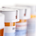 prescription pill bottles in a line