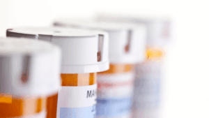 prescription pill bottles in a line
