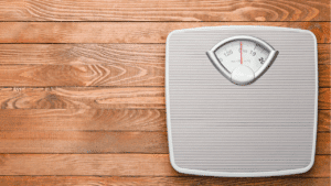 a scale on a wood floor