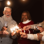 Older adults cheers with glasses of wine and sparklers